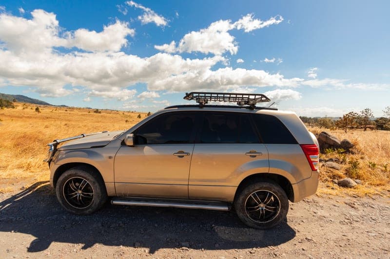 Representative photo of wing-profile crossbars mounted across a vehicle roof
