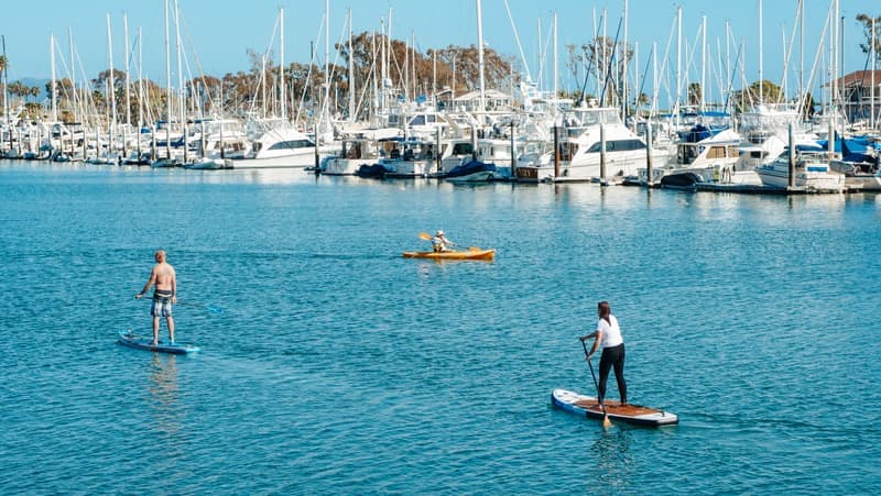 Representative photo of roller-and-saddle kayak carriers on crossbars