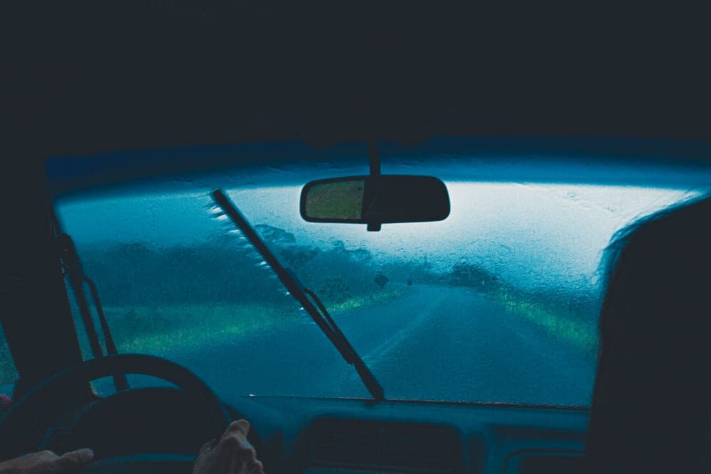 The view through a windscreen while driving on a highway
