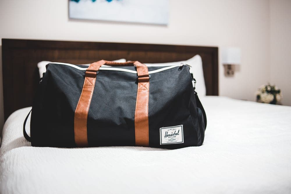 Suitcases and duffel bags packed ready to load