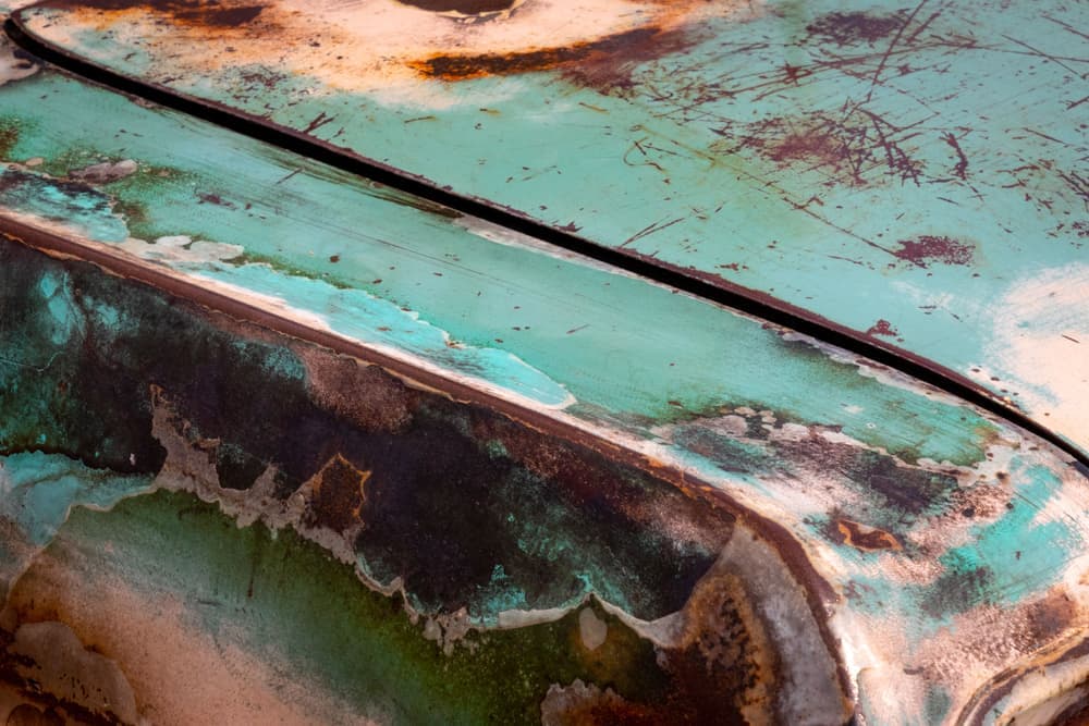 A close view of a car's painted bodywork showing surface marks