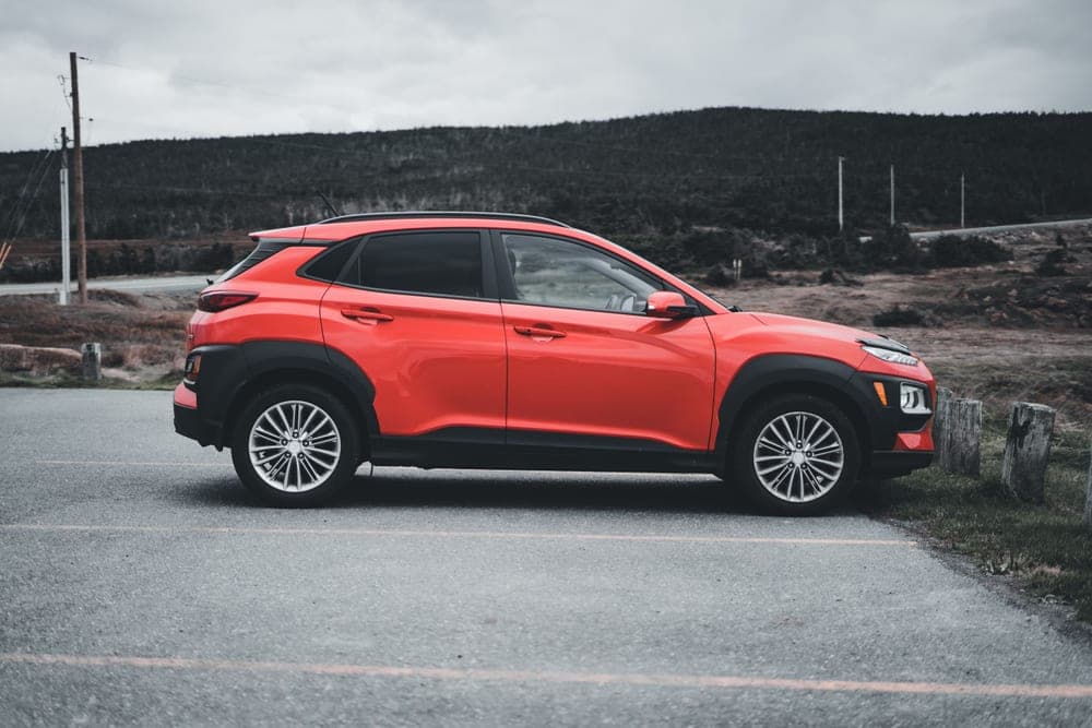 A compact crossover SUV with roof rails parked outdoors